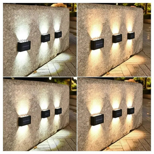 Kit de 2 lámparas solares de pared mini con 6 LED. Se cargan con el sol y se encienden solas al anochecer, sin cables ni factura de luz. Fáciles de instalar en patio, jardín, escaleras, entradas y garaje.