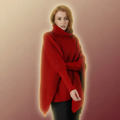 Ruana Sofía roja para mujer en acrílico suave, cálido y liviano. Cuello alto en rib, mangas largas con puños ajustados y silueta oversize. Talla única. Hecha en Colombia. Ideal para diciembre.